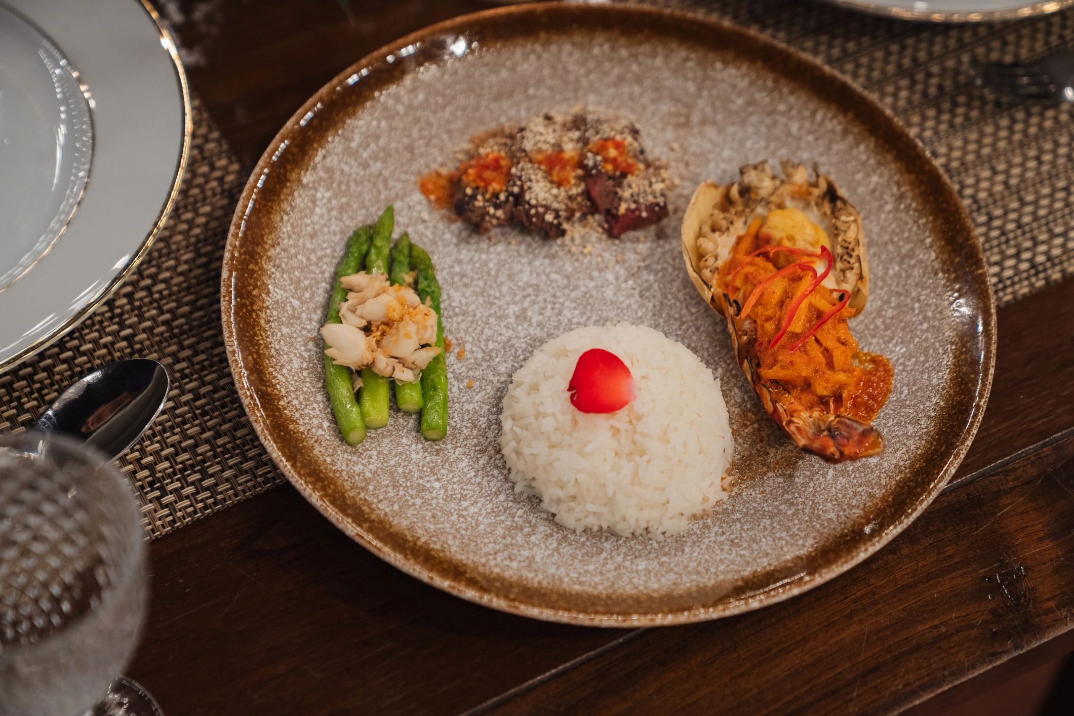Elegant plated Asian fusion dish with seafood vegetables and rice