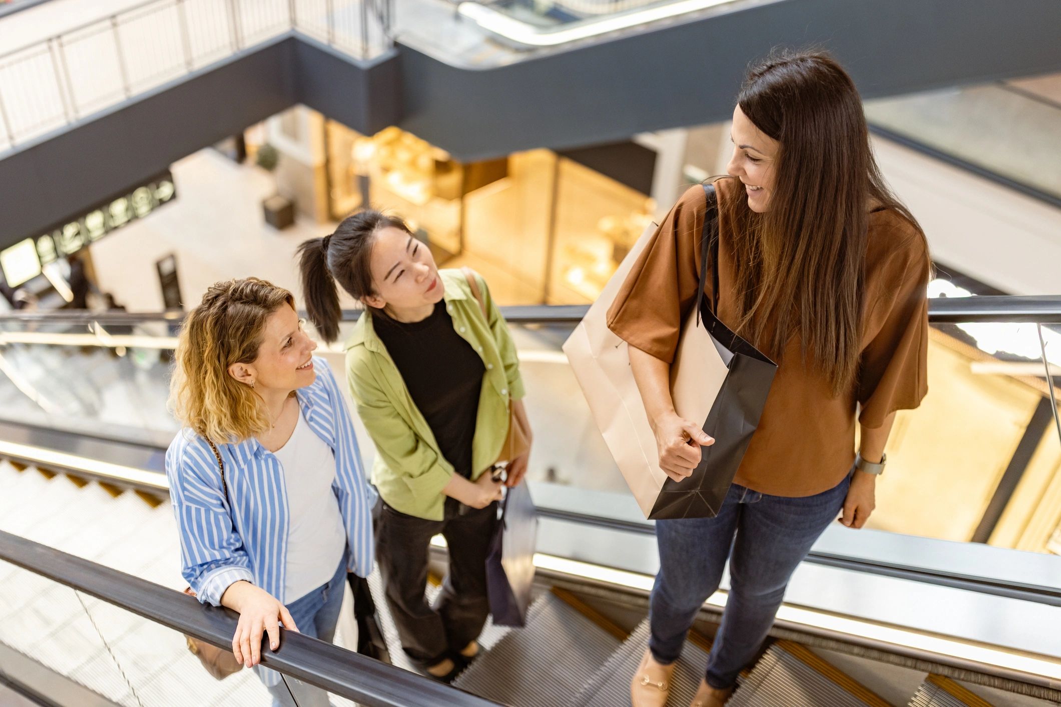 Friends enjoying a shopping trip in a bright retail setting