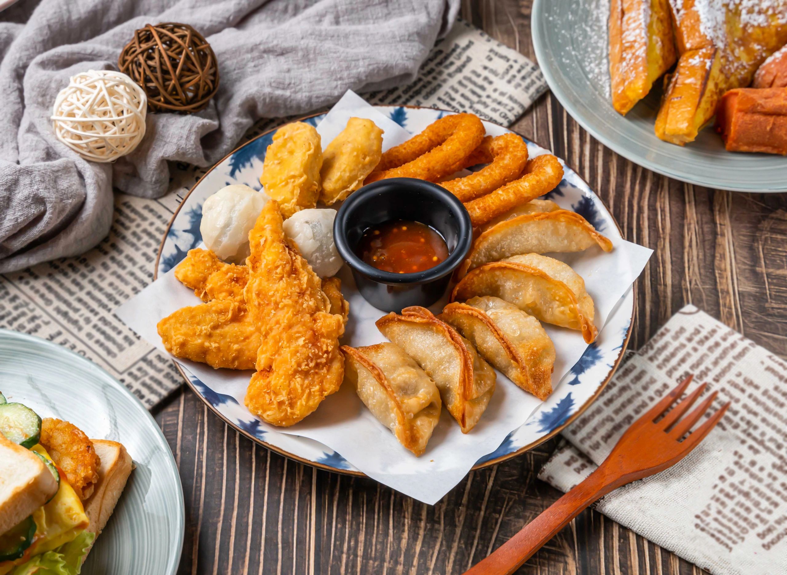 Assorted Asian dumplings and fried bites with dipping sauce
